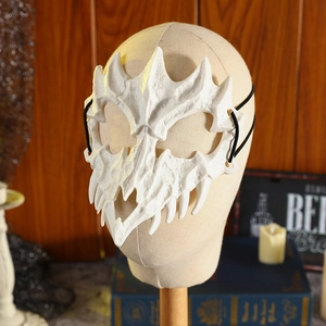 Japanese style white beast bone mask for Halloween cosplay on dark wooden background