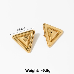 Detailed view of 29mm gold-layered triangular earrings with polished 3D metal texture