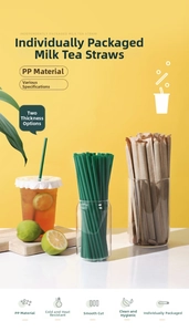 Close-up of individually wrapped green PP straws showing thick and thin options