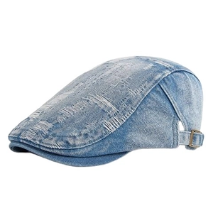 Distressed denim ivy cap in light blue wash featuring vintage ripped details and metal buckle