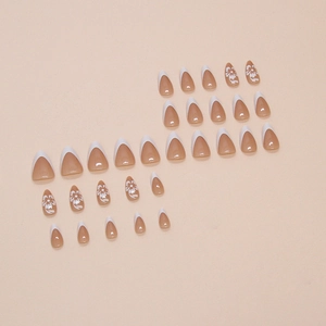 French white tip press-on nails with white floral patterns on almond shape set