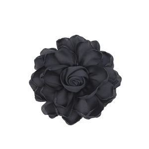 Close-up of black satin fabric rose with multilayered petals for DIY jewelry making