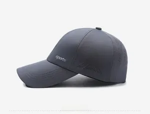 Detail of laser-cut ventilation holes and sports print on dark grey quick-dry cap