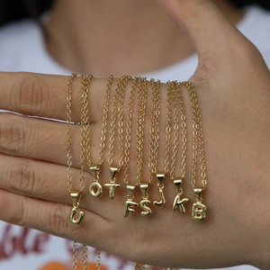 Golden 18k plated 3D bubble letter necklaces with shiny polished metal surface