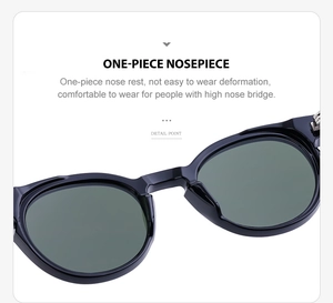 Detailed close-up of integrated one-piece nosepiece on oval black frame sunglasses