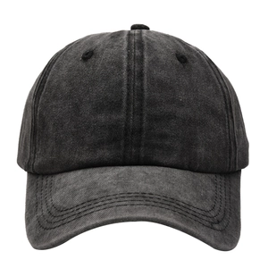 Detail of washed grey cotton baseball cap with vintage distressed texture and curved brim