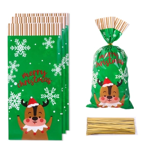 Green Christmas candy bags with reindeer and snowflake patterns and gold twist ties