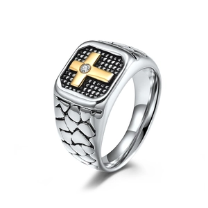 Vintage stainless steel ring for men featuring a gold cross and black mesh texture