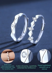Macro detail of silver wedding bands showing Cubic Zirconia shine and manual polishing