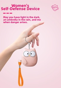 Pink owl-shaped personal security alarm with metal keychain and orange braided strap