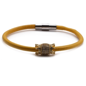 Braided yellow leather bracelet with gold-tone rhinestone crown and magnetic clasp