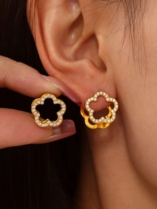 Macro shot of 18K gold plated floral hoop earrings with sparkling zircon inlay for women