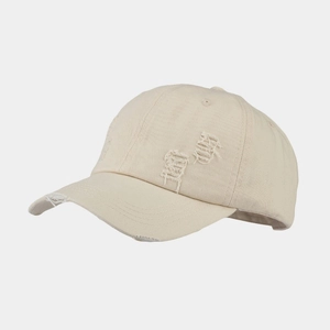 Detailed side view of distressed washed cotton baseball cap with ripped hole accents