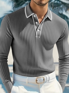 Close-up of grey long sleeve knit polo shirt featuring white collar and button placket
