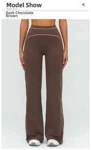 Detail view of high-waisted wide leg yoga pants in deep chocolate brown with white stitching