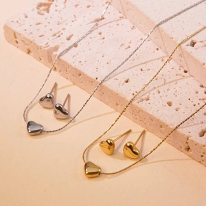 Titanium steel heart necklace and earring set in gold and silver on stone