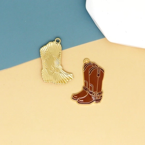 Detailed view of gold and brown enamel cowboy boot charms for DIY jewelry making