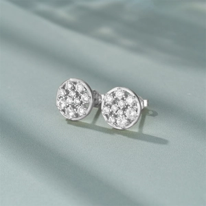Close-up of geometric S925 sterling silver stud earrings with pavé set zirconia