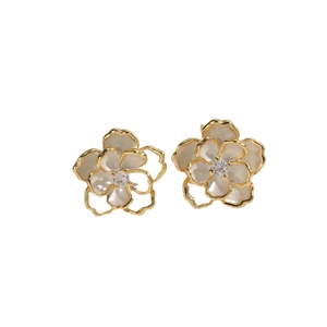 Elegant gold-edged camellia flower earrings with white enamel petals and zircon center