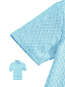 Detailed macro view of light blue polo shirt cuff showing 3D textured geometric jacquard fabric