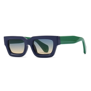 Modern irregular thick frame sunglasses with deep blue front and bright green temples