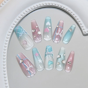 Handmade ballerina press-on nails with 3D bows, stars, and heart patterns in pastel colors