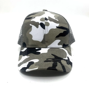 Close-up of camouflage print trucker hat with breathable mesh back and curved brim