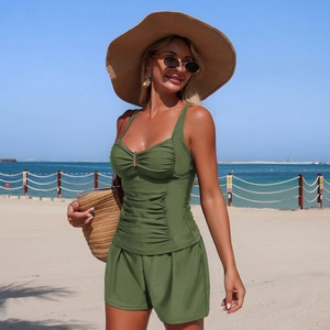Detail of olive green tankini top with ruched texture and elegant metal ring hardware