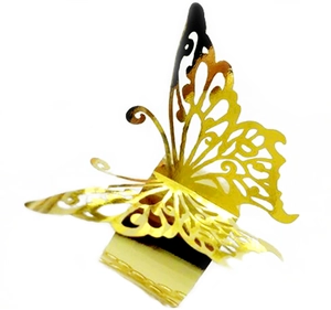 Detailed macro view of 3D hollow butterfly napkin ring with gold mirror finish effect