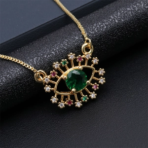 Golden evil eye pendant necklace with green center stone and colorful zircon eyelashes