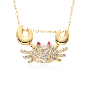 Gold-plated crab pendant necklace with micro-paved white zircons and red gemstone eyes
