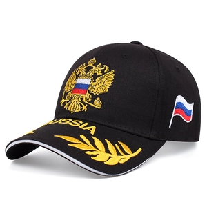 Detail of embroidered Russian emblem and gold olive branch on black baseball cap brim