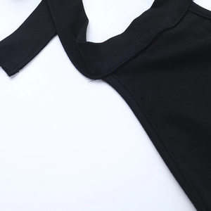 Close-up of black halter neck collar with ribbed knit texture and stitching detail
