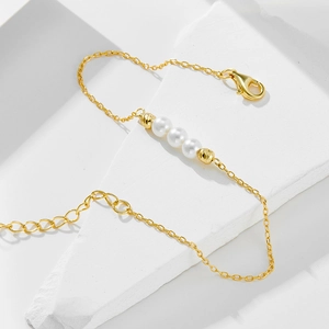 Elegant S925 sterling silver beaded bracelet with three white pearls in golden finish