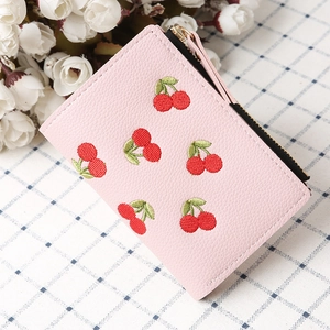 Pink lychee grain leather wallet with cherry embroidery and gold zipper detail