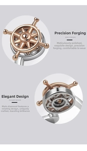 Macro detail showing the rotating nautical ship wheel design and polished metal craftsmanship