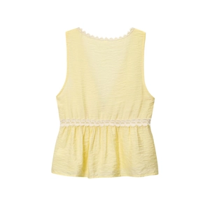 Close-up of yellow sleeveless V-neck top showing textured fabric and delicate lace trim