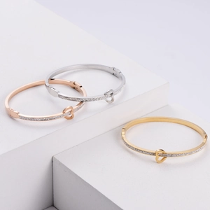 Three-color titanium steel heart bangles with rhinestones in gold, silver, and rose gold