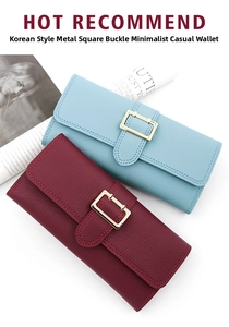 Detail of minimalist long wallets with gold metal buckle and pebbled leather texture