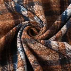 Macro shot of plaid checkered scarf fabric texture showing soft cashmere-like faux fur detail