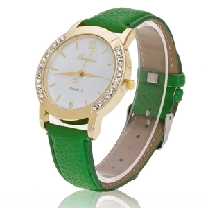 Close-up of a ladies' quartz watch with a diamond-encrusted bezel and green leather strap