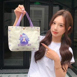 Minimalist canvas tote bag with purple handles and cute cartoon starry sky design