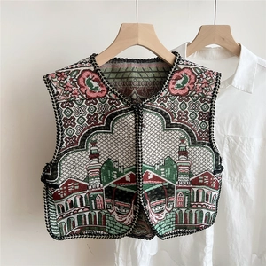 Detailed ethnic embroidery patterns on vest shawl with architectural floral motifs