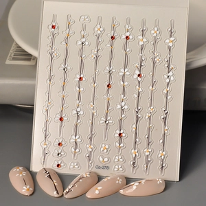 Detailed 3D nail art stickers Co-278 featuring white daisy and black vine patterns