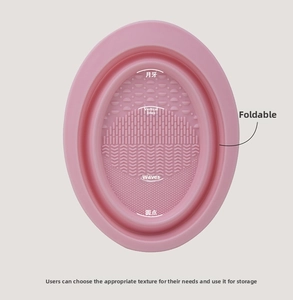 Pink silicone folding makeup brush cleaning bowl with four specialized texture patterns