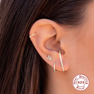 925 sterling silver ear jewelry set with three hoops and one snake stud on model ear