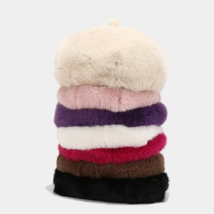 Plush beret hats in seven colors featuring soft faux fur texture and minimalist design