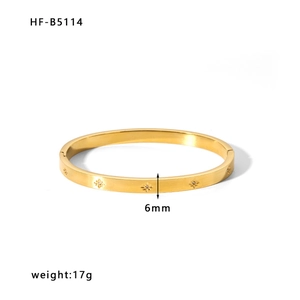 Detail of 6mm 18k gold-plated stainless steel bangle with engraved star patterns