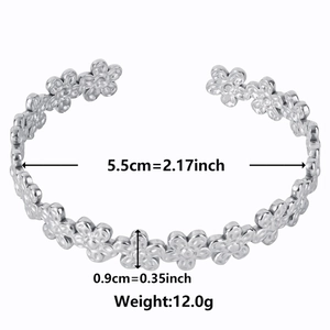 Silver flower cuff bracelet in stainless steel with daisy cutout design and open ends