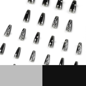 Coffin shaped press-on nails with black gradient, white butterflies and shiny rhinestones